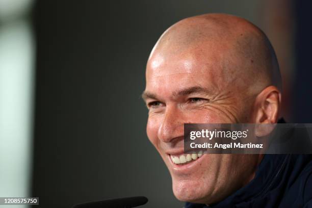 Zinedine Zidane, Head Coach of Real Madrid reacts during a press conference ahead of their UEFA Champions League round of 16 first leg match against...