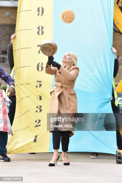 Holly Willoughby and Phillip Schofield with Ainsley Harriott attempt a world record for tossing pancakes during the This Morning show. On February...