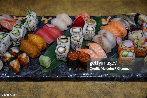 sushi platter - selection of different sushi types - sushi plate stock pictures, royalty-free photos & images