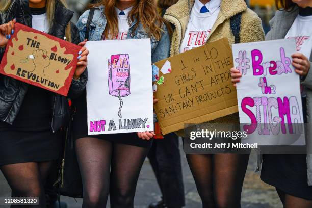 Campaigners and activists rally outside the Scottish Parliament in support of the Scottish Governments Support For Period Products Bill on February...