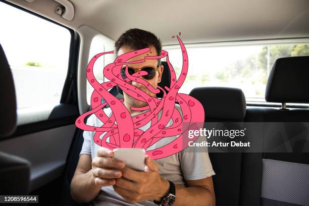 surreal picture with monster illustration emerging from mobile phone. - octpus stock pictures, royalty-free photos & images