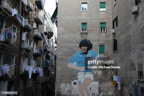 Street art showing ex Napoli player Diego Maradona in the city of Naples ahead of the UEFA Champions League round of 16 first leg match between SSC...