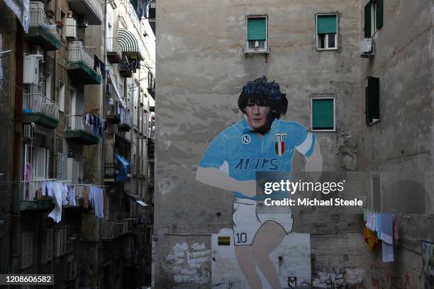 Street art showing ex Napoli player Diego Maradona in the city of Naples ahead of the UEFA Champions League round of 16 first leg match between SSC...