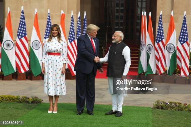 India-America Summit, left to right Mrs Melania Trump, Mr Donald Trump and Mr Narendra Modi step out for a traditional handshake before they sat down...