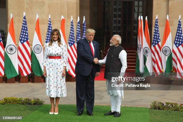 India-America Summit, left to right Mrs Melania Trump, Mr Donald Trump and Mr Narendra Modi step out for a traditional handshake before they sat down...