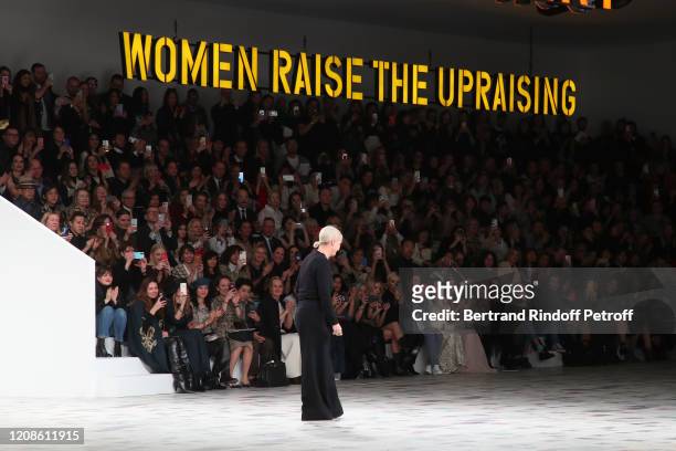 Stylist Maria Grazia Chiuri acknowledges the applause of the audience at the end of the Dior show as part of the Paris Fashion Week Womenswear...