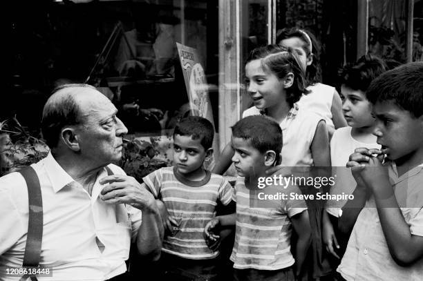 American actors Buster Keaton talks with a group of children during the filming of his movie, 'Film' , New York, New York, 1964.