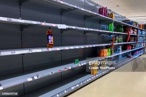 Empty shelves in a Tesco store in Kent as shoppers stockpile basic consumer goods for fears of a potential quarantine due to an outbreak of...