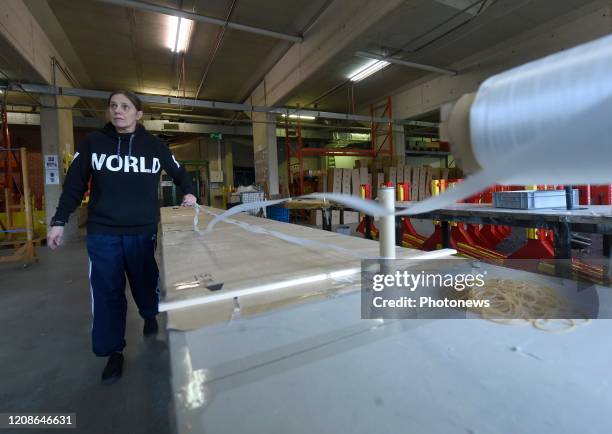 Brussels, Belgium March 30, 2020 -Atelier TRAVIE à Anderlecht confectionne des milliers de masques de protection. - Werkplaats TRAVIE in Anderlecht...