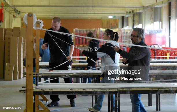 Brussels, Belgium March 30, 2020 -Atelier TRAVIE à Anderlecht confectionne des milliers de masques de protection. - Werkplaats TRAVIE in Anderlecht...