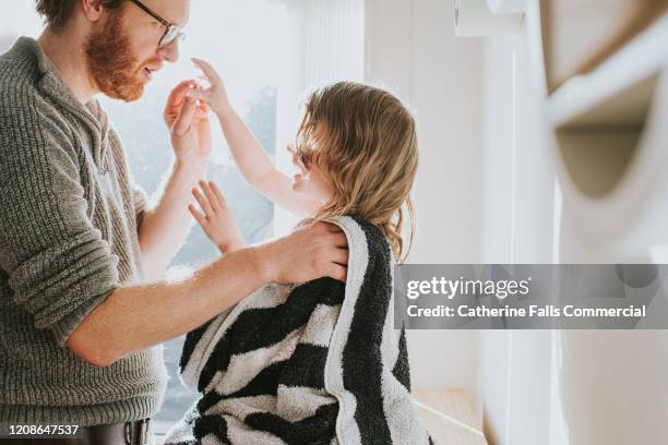 towel drying daughter - defending home stock pictures, royalty-free photos & images