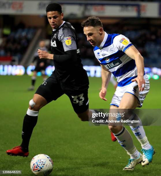 Marc Pugh of QPR takes on Curtis Davies of Derby County during the Sky Bet Championship match between Queens Park Rangers and Derby County at The...