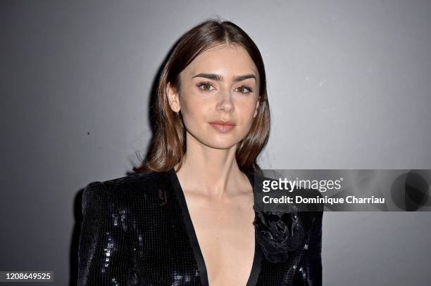 Lily Collins attends the Saint Laurent show as part of the Paris Fashion Week Womenswear Fall/Winter 2020/2021 on February 25, 2020 in Paris, France.