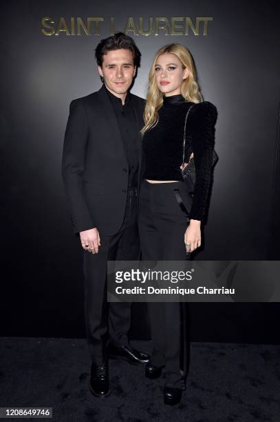 Brooklyn Beckham and Nicola Peltz attend the Saint Laurent show as part of the Paris Fashion Week Womenswear Fall/Winter 2020/2021 on February 25,...