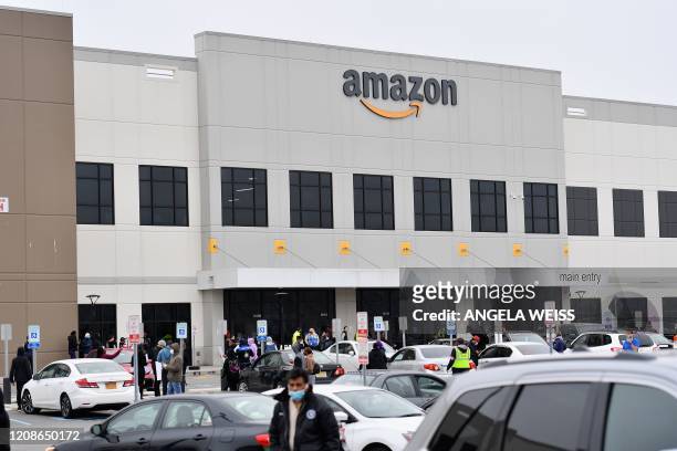 Amazon workers at Amazon's Staten Island warehouse strike in demand that the facility be shut down and cleaned after one staffer tested positive for...