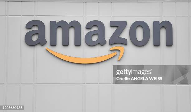 The logo of US online retail giant Amazon is seen at the distribution center in Staten Island as workers strike in demand that the facility be shut...