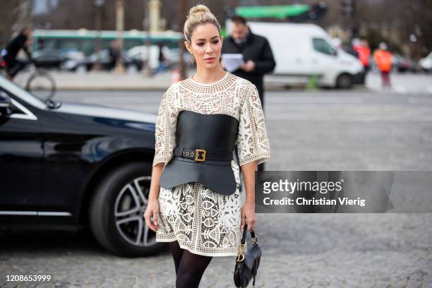 Guest is seen wearing corset, sheer dress outside Dior during Paris Fashion Week - Womenswear Fall/Winter 2020/2021 : Day Two on February 25, 2020 in...