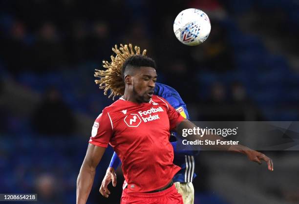 Cardiff player Dion Sanderson challenges Sammy Ameobi of Forest during the Sky Bet Championship match between Cardiff City and Nottingham Forest at...