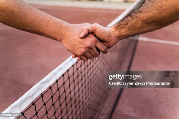 two tennis players shaking hands across the net - sport set competition round ストックフォトと画像