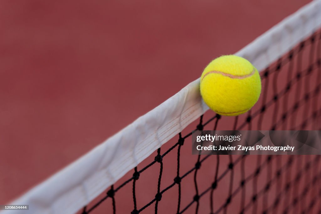 Tennis Ball Hitting The Net