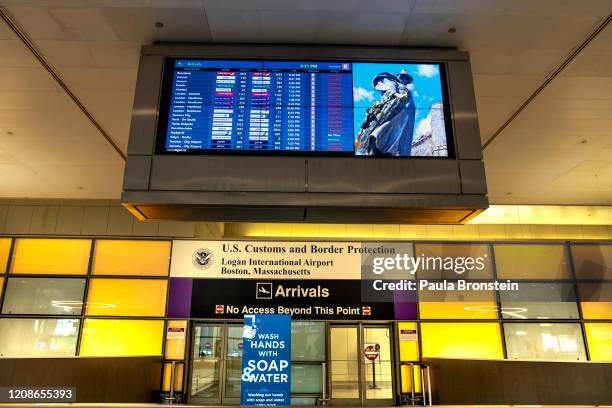 An empty arrival area at Logan International Airport on March 27, 2020 in Boston, Massachusetts. Travel restrictions are being imposed by countries...