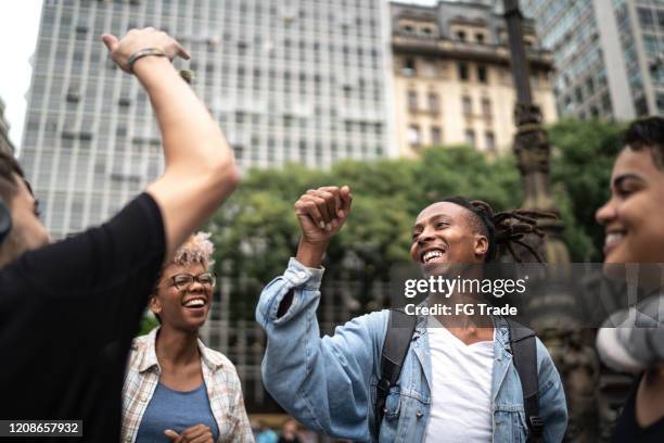 friends having good time together in the city - dancing people walker stock pictures, royalty-free photos & images