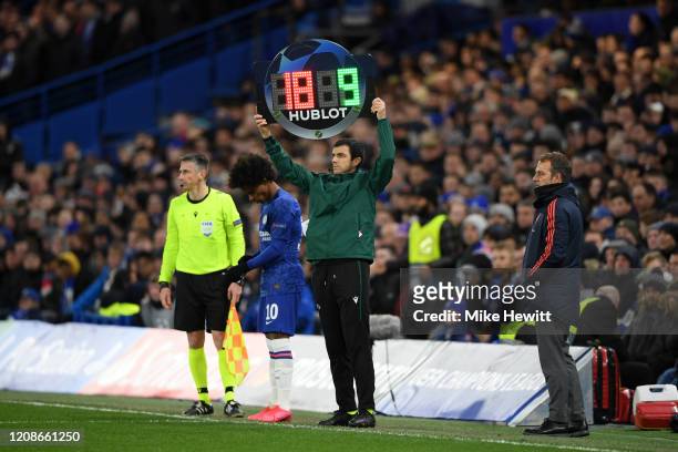 The fourth official signals for a substitution during the UEFA Champions League round of 16 first leg match between Chelsea FC and FC Bayern Muenchen...
