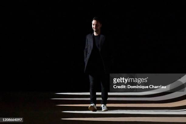 Anthony Vaccarello walks the runway after the Saint Laurent show as part of the Paris Fashion Week Womenswear Fall/Winter 2020/2021 on February 25,...