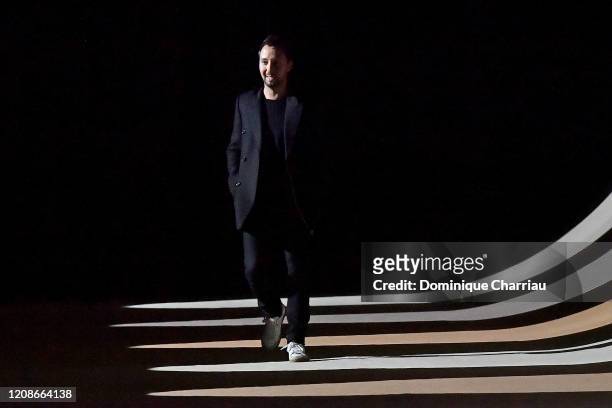 Anthony Vaccarello walks the runway after the Saint Laurent show as part of the Paris Fashion Week Womenswear Fall/Winter 2020/2021 on February 25,...