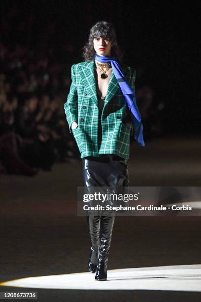 Mica Arganaraz walks the runway during the Saint Laurent show as part of the Paris Fashion Week Womenswear Fall/Winter 2020/2021 on February 25, 2020...