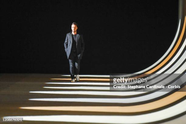 Stylist Anthony Vaccarello walks the runway during the Saint Laurent show as part of the Paris Fashion Week Womenswear Fall/Winter 2020/2021 on...
