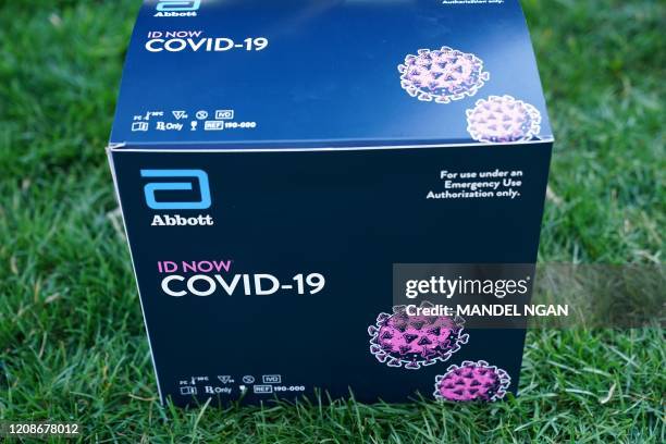 Box containing a 5-minute test for COVID-19 from Abbott Laboratories is pictured during the daily briefing on the novel coronavirus, COVID-19, in the...