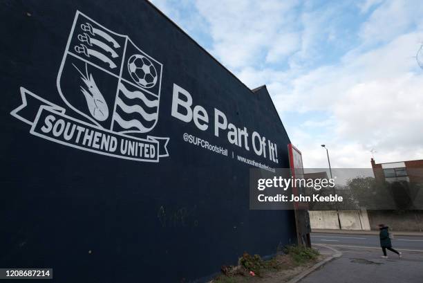 Side of a building is painted with the Southend United FC badge and the slogan "Be part of it!" next to the Roots Hall stadium home of League One,...