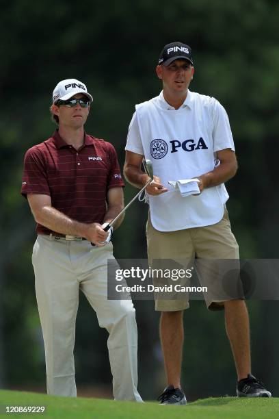 Marty Jertson waits with his caddie during the first round of the 93rd PGA Championship at the Atlanta Athletic Club on August 11, 2011 in Johns...