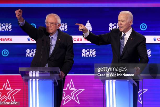 Democratic presidential candidate former Vice President Joe Biden speaks as Sen. Bernie Sanders loo during the Democratic presidential primary debate...