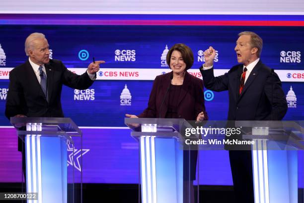 Democratic presidential candidates former Vice President Joe Biden and Tom Steyer debate as Sen. Amy Klobuchar reacts during the Democratic...