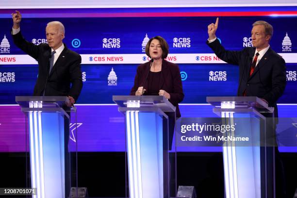 Democratic presidential candidate Sen. Amy Klobuchar speaks as former Vice President Joe Biden and Tom Steyer look on during the Democratic...