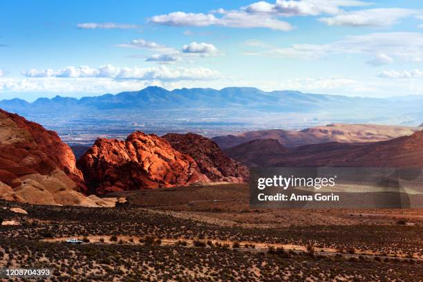 red rock canyon at sunset looking toward las vegas valley, nevada, in winter - las vegas sunset stock pictures, royalty-free photos & images