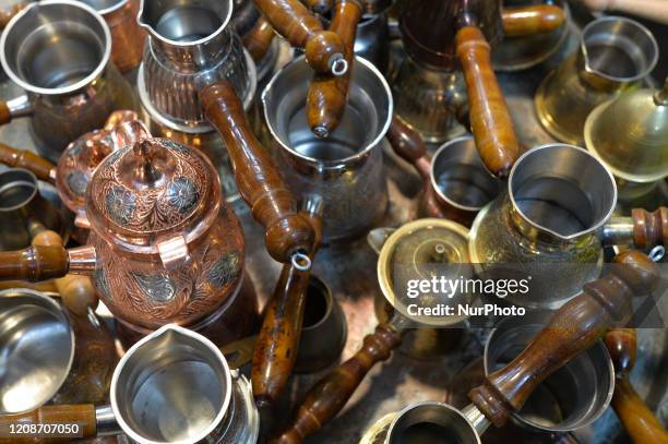 Shop selling different types of cezve, a small long-handled pot with a pouring lip designed specifically to make Turkish coffee, seen in a tourist...