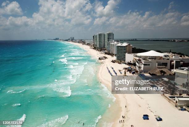 Aerial view of an almost empty beach in Cancun, Quintana Roo state, Mexico, on March 28, 2020. - A significant drop in the number of tourists is...