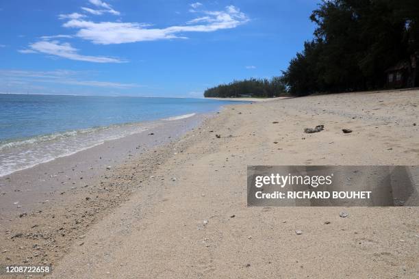 This picture taken on March 31, 2020 shows empty Sain-Gilles de la Reunion beaches, on the French overseas department of La Reunion, which are...