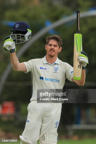 Daniel Hughes of the Blues celebrates his century during day three of the Sheffield Shield match between New South Wales and South Australia at...
