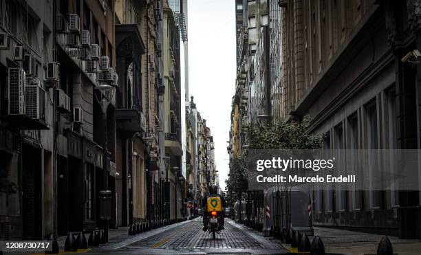 Delivery drives on Tucuman street on March 31, 2020 in Buenos Aires, Argentina. Last Sunday President Fernandez announced an extension of the total...