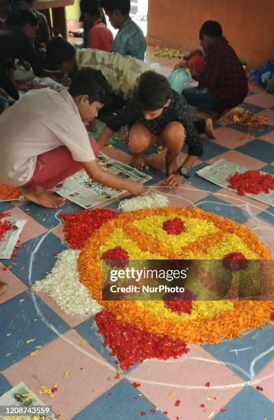 School children create flower designs on the floor of their school during the festival of Onam in Thiruvananthapuram , Kerala, India. Onam is a major...