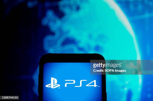In this photo illustration a PlayStation 4 logo seen displayed on a smartphone.