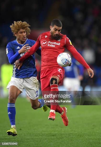 Forest player Lewis Grabban holds off the challenge of Dion Sanderson of Cardiff during the Sky Bet Championship match between Cardiff City and...