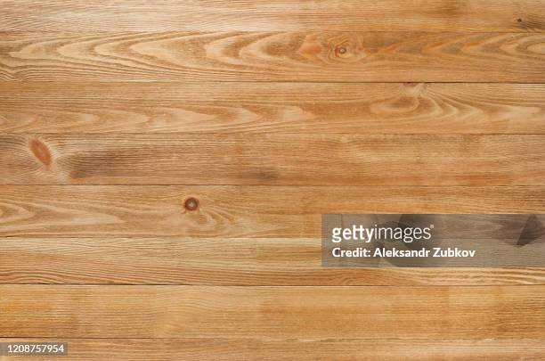 new wooden board painted with protective paint. textured structural background. - wood material foto e immagini stock