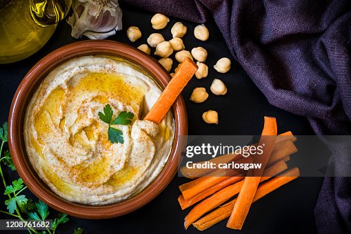 Homemade hummus with carrot sticks Homemade hummus with carrot sticks