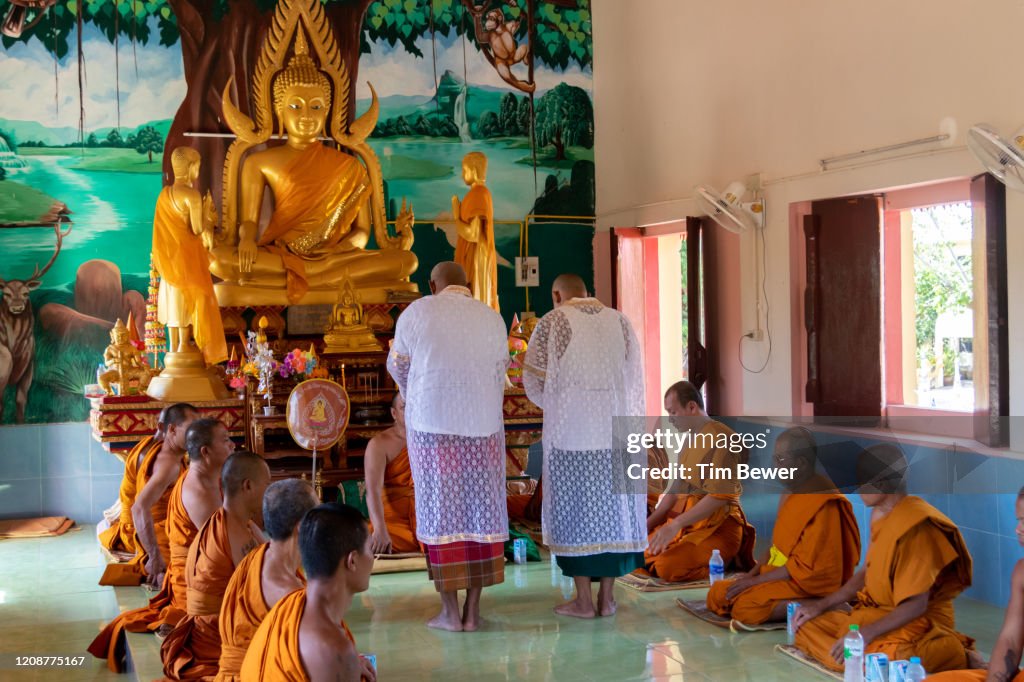 Ordaining as Buddhist monks.