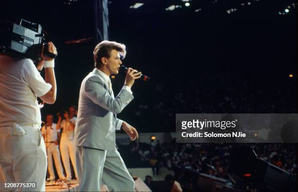David Bowie, Live Aid, being filmed by BBC TV cameraman, 13 July 1985 Wembley Stadium, London.